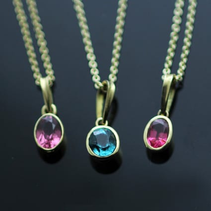 OVAL CUT PINK TOURMALINE SET IN 18CT YELLOW GOLD NECKLACE