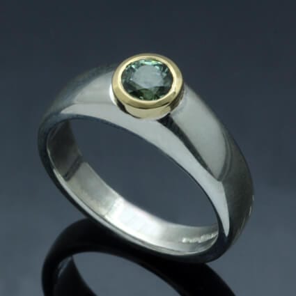 JS ROUND BRILLIANT CUT GREEN SAPPHIRE SET IN 18CT YELLOW GOLD & STERLING SILVER
