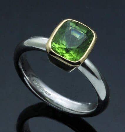 JS CUSHION CUT PERIDOT SET IN 18CT YELLOW GOLD & STERLING SILVER