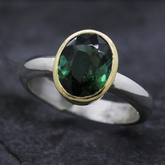 JS OVAL GREEN TOURMALINE SET IN 18CT YELLOW GOLD & STERLING SILVER